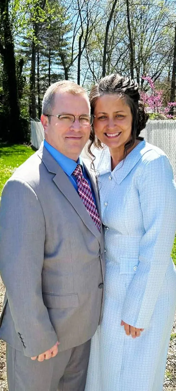 Nathan Green and his wife outdoors in formal attire